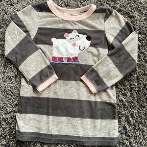Warm nightie with alternating gray stripes and skating polar bear. Size 5